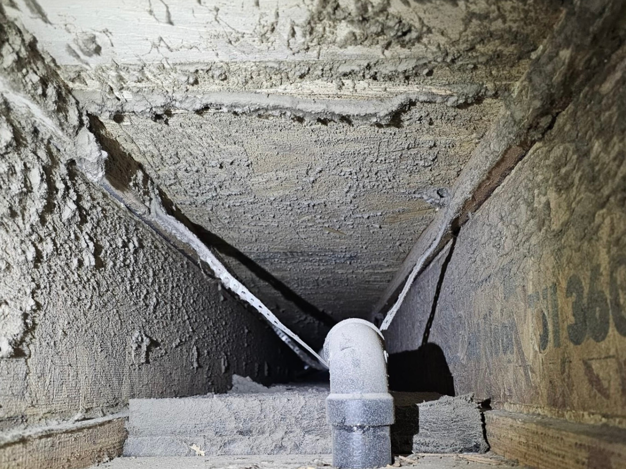 A dusty air duct vent before cleaning