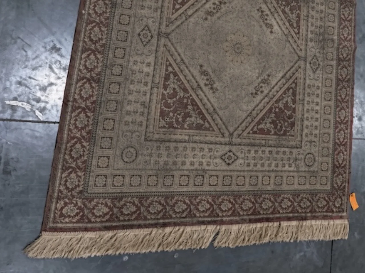 Close-up of the fringe on the heirloom silk rug