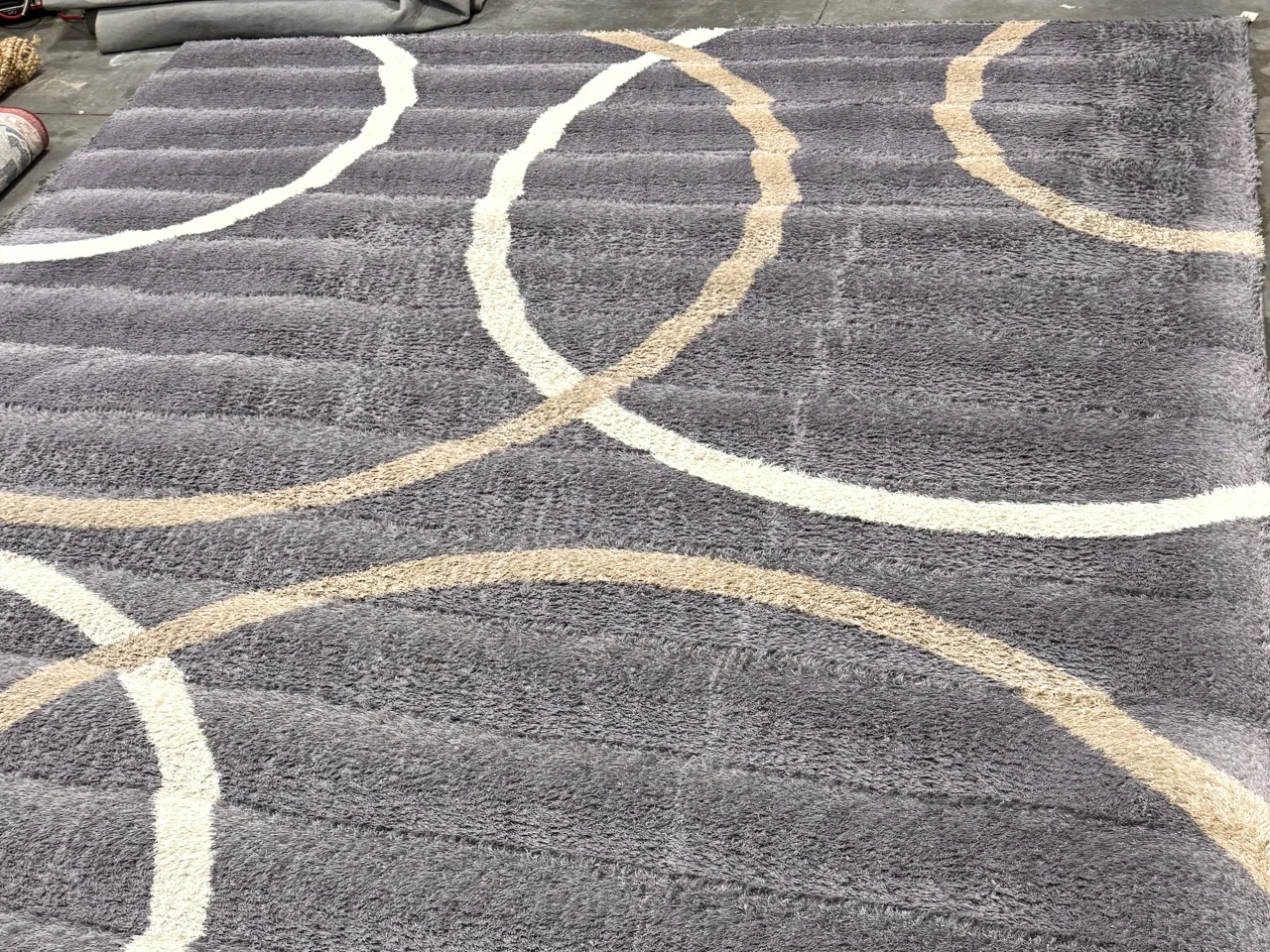 Modern gray wool rug with cream and beige arcs after cleaning, La Center, WA