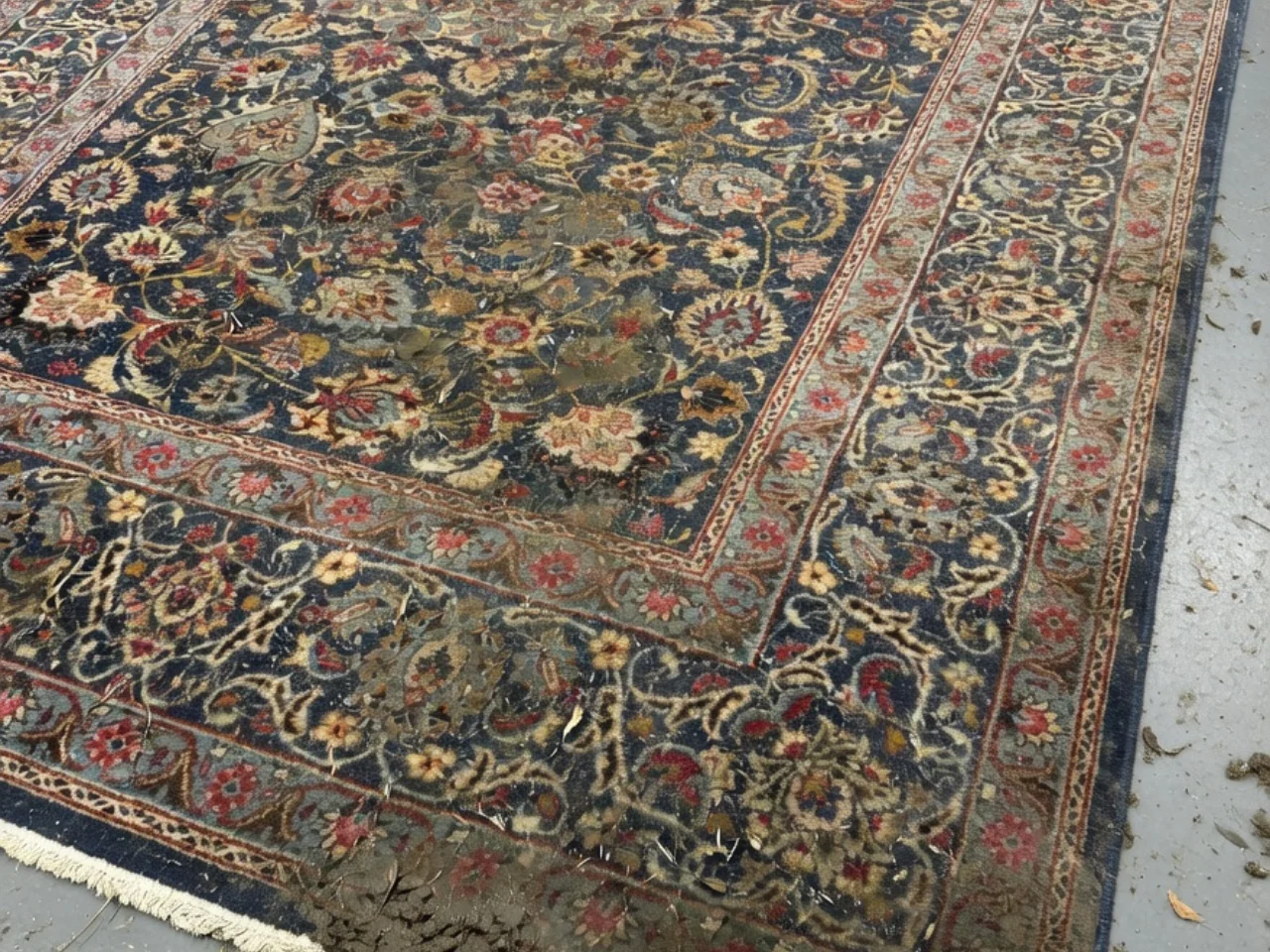 Before: muddy hand-knotted Persian-style wool rug from a West Linn, OR home before cleaning