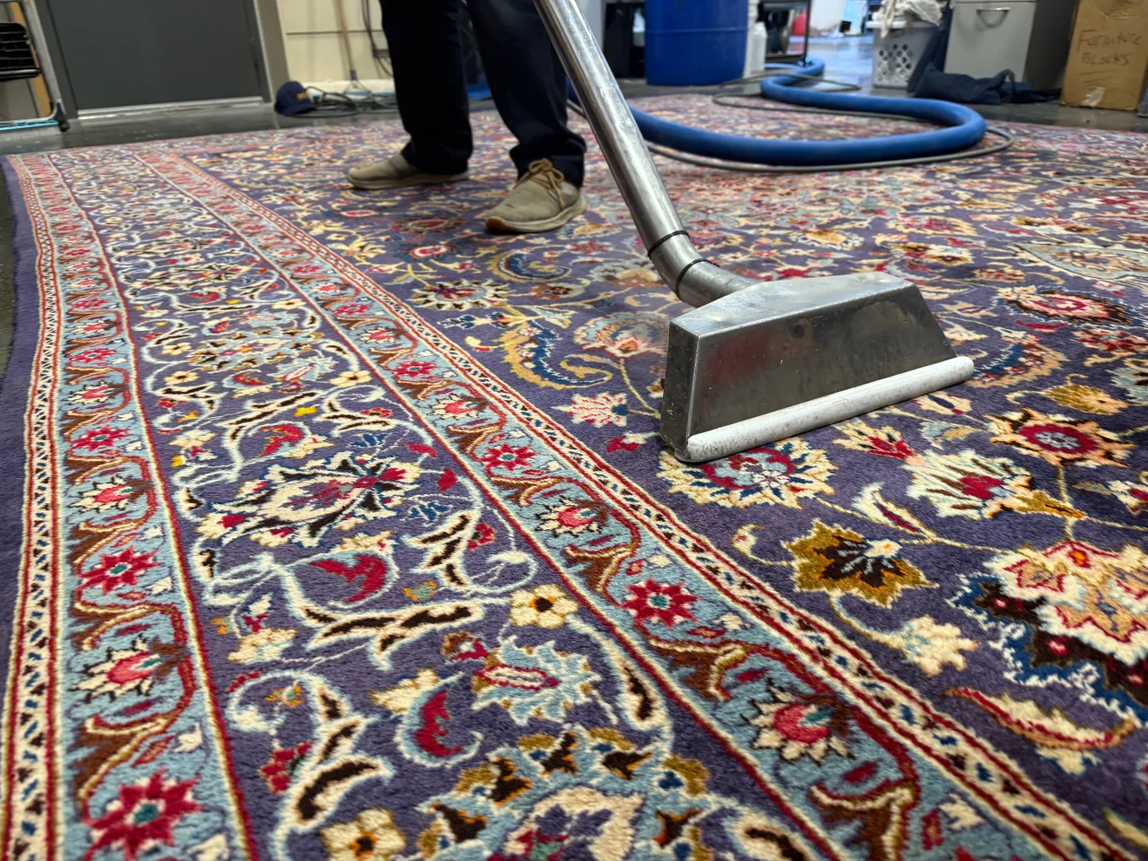 The 8x10 Persian wool rug during cleaning at the Benchmark plant, second view