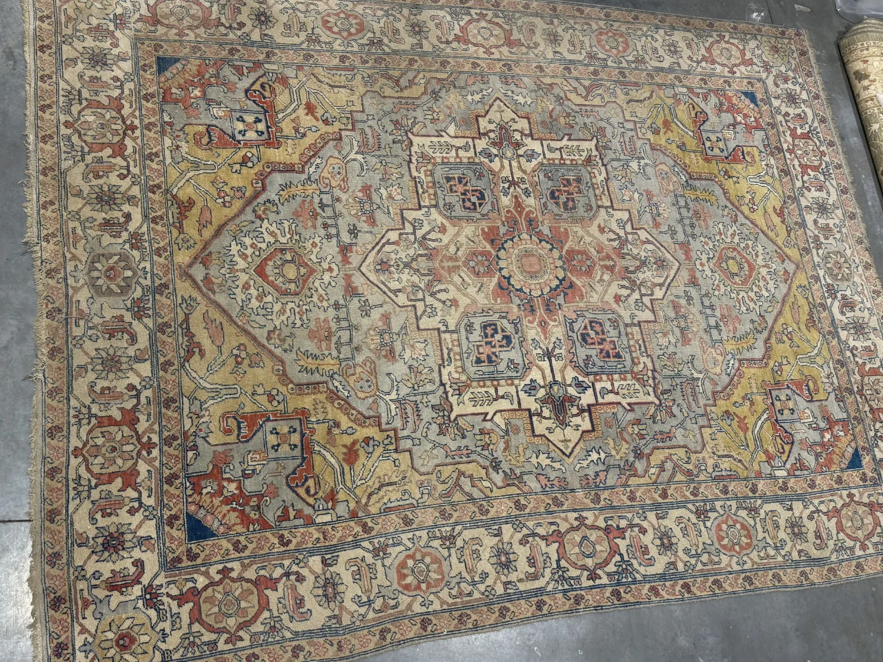 Before: dulled Persian 9x12 rug with muted color from a Ridgefield, WA home before cleaning