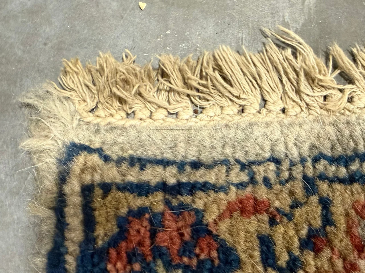 Inspection of the fringe on the Persian 9x12 rug