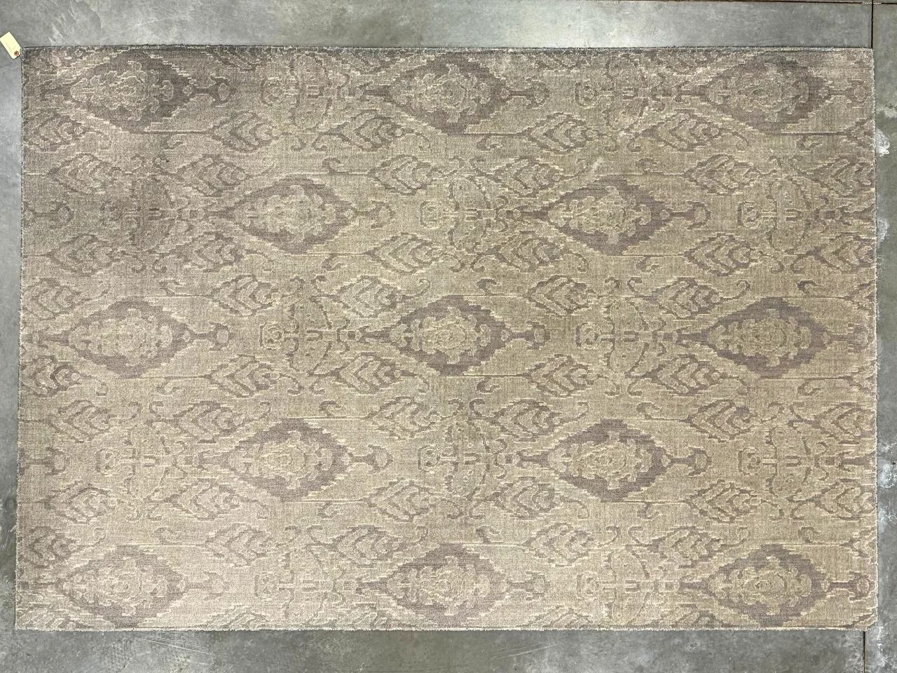 Before: heavily soiled gray silk rug from a Camas, WA home with dark traffic paths and dull color