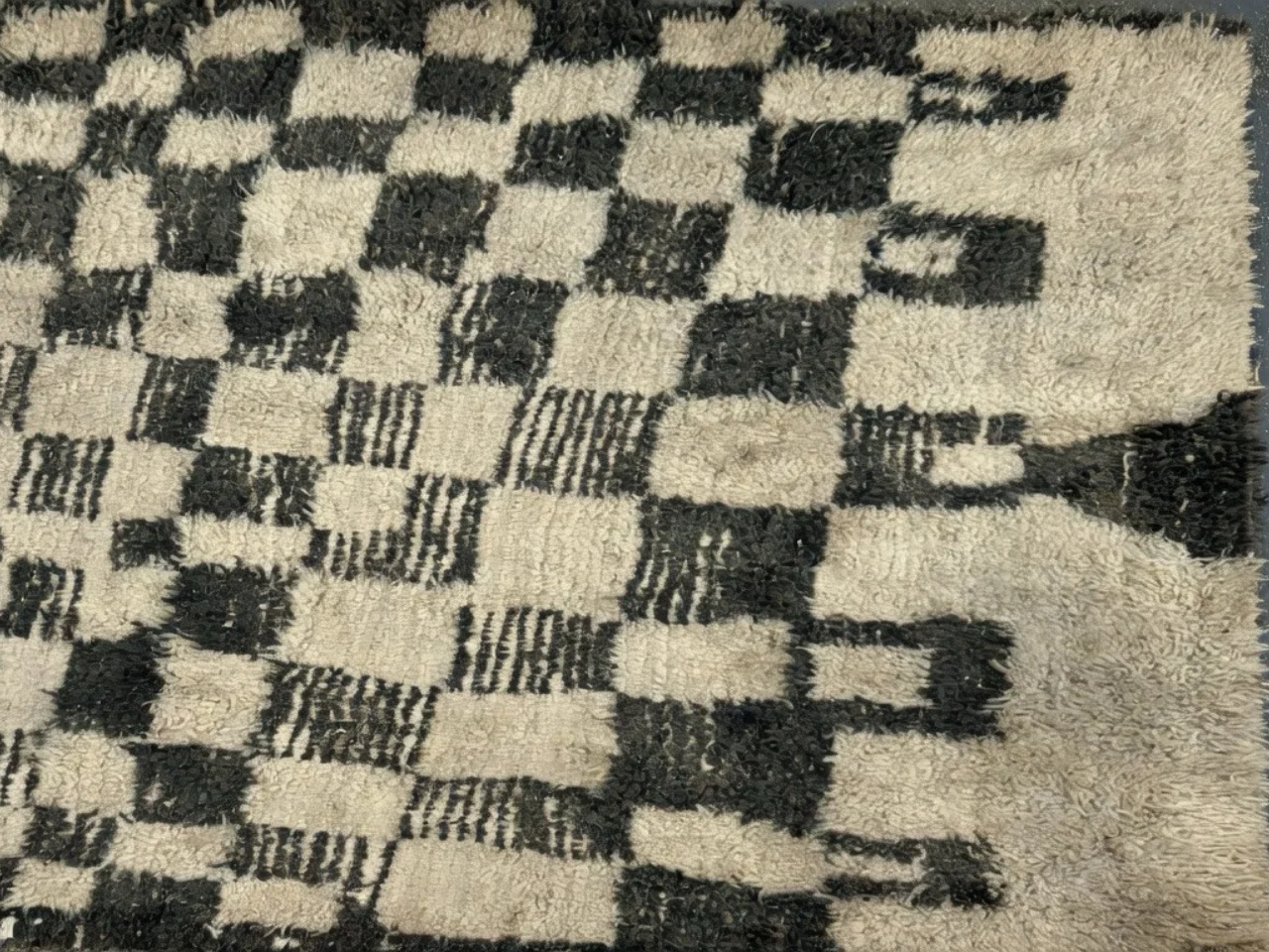 Before: discolored sheep’s wool checkerboard shag rug from a West Linn, OR home before cleaning