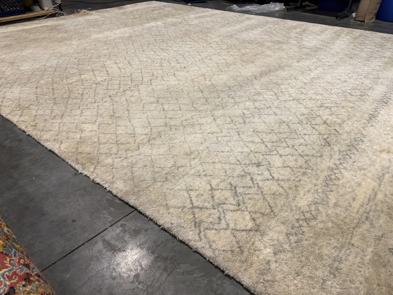 The modern 9x12 wool rug just before cleaning at the Benchmark rug plant