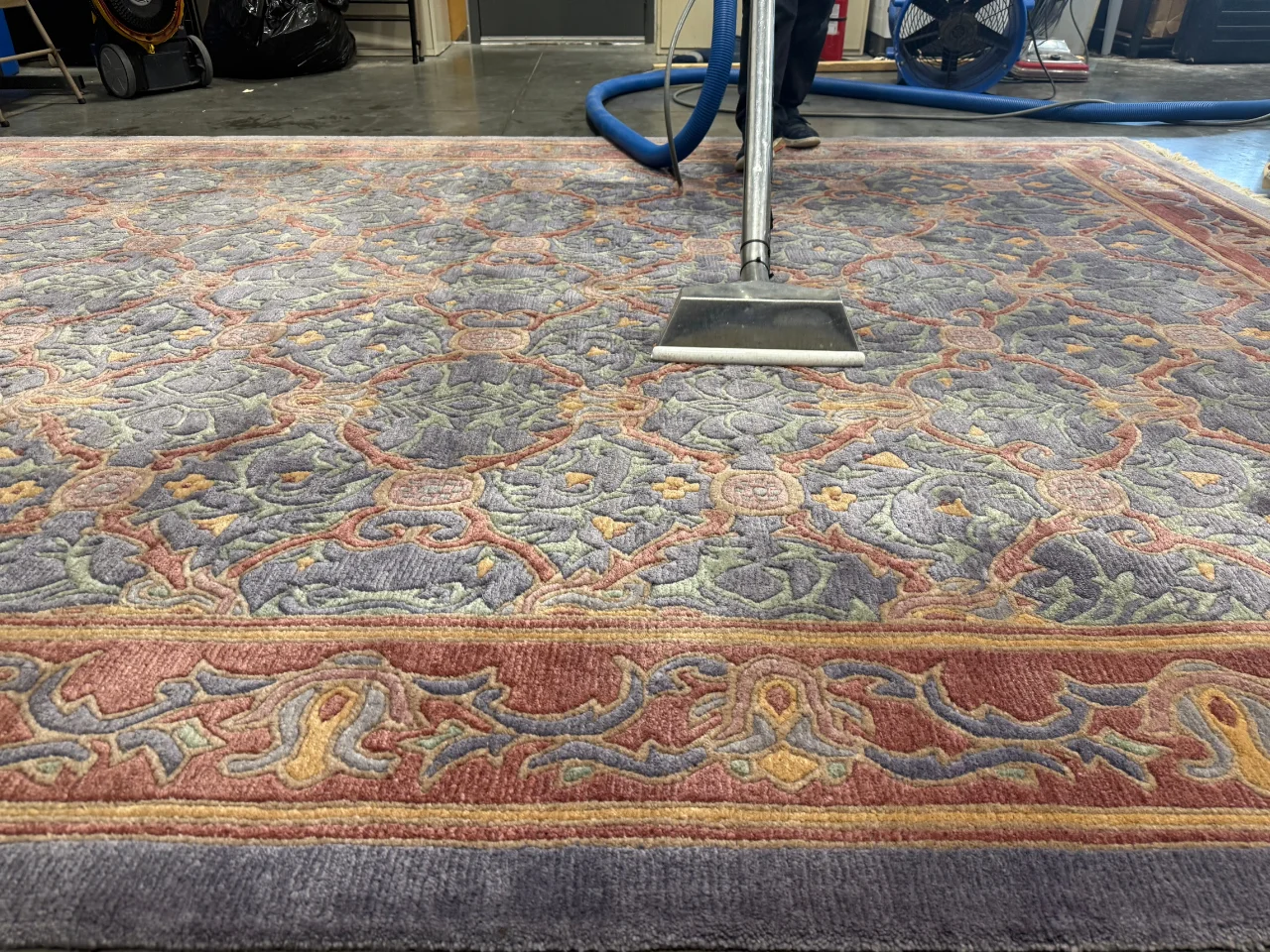 The Oriental-style wool rug during cleaning at the Benchmark plant