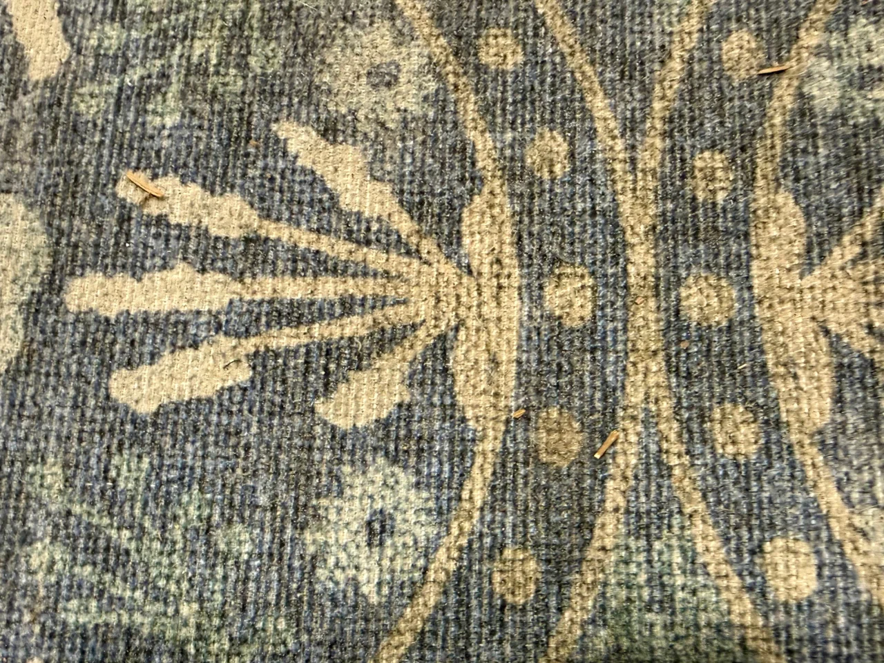 Before: dull, heavily soiled blue and ivory wool-blend rug with a medallion pattern from a Ridgefield, WA home