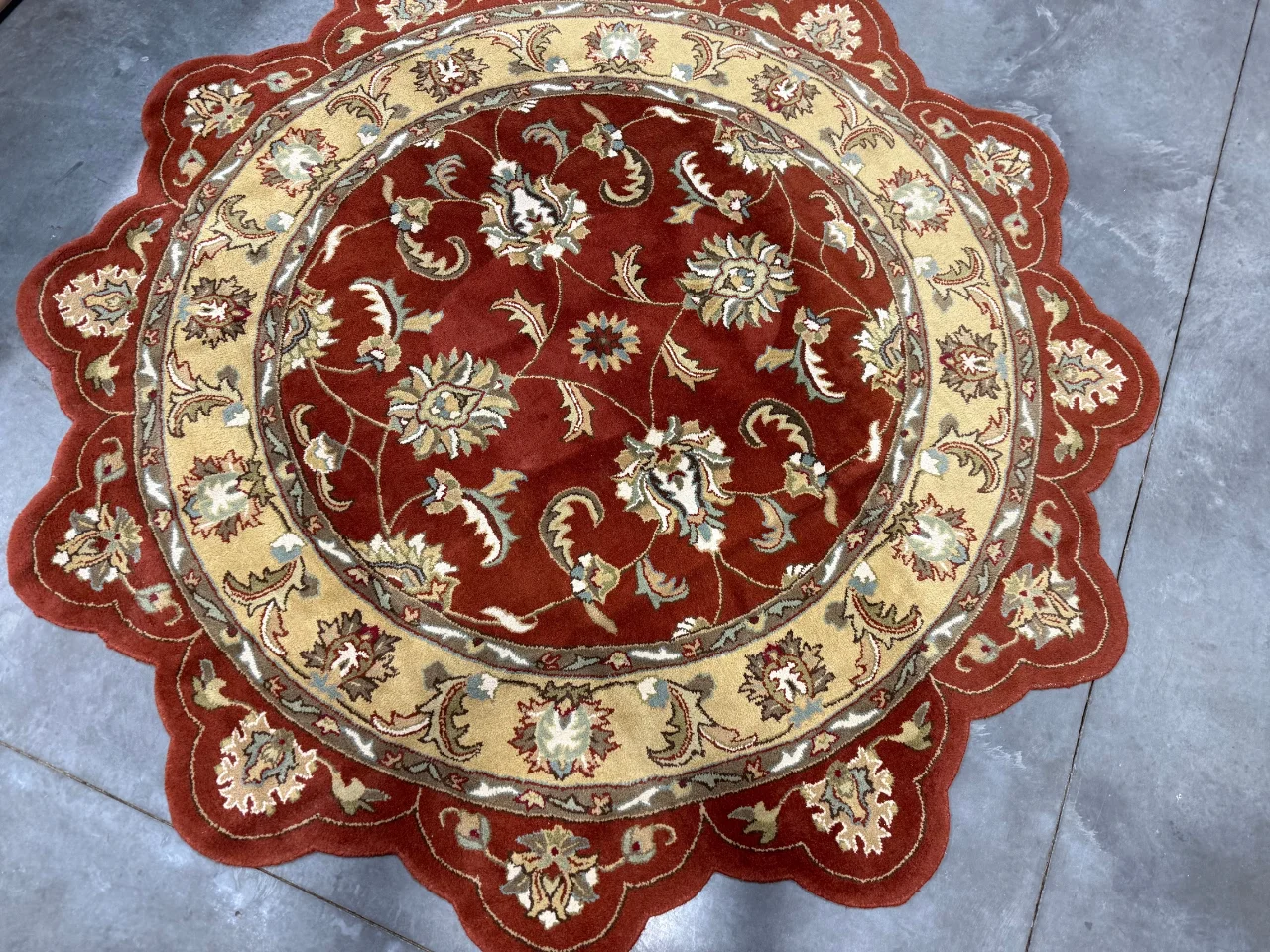 A cleaned area rug from a Battle Ground, WA home, shown before and after cleaning